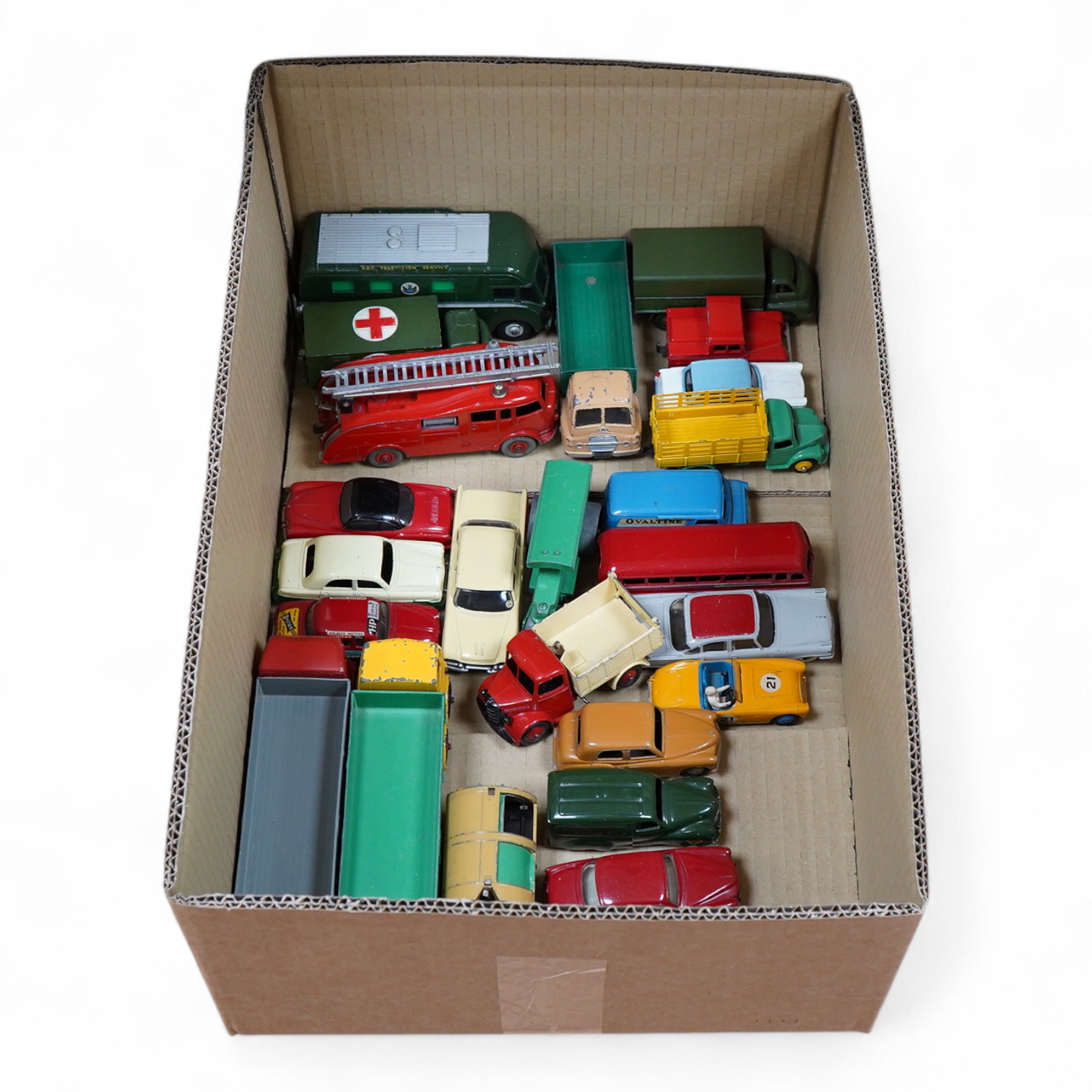 Twenty-five Dinky Toys including; Foden FG wagon, Leyland octopus wagon, TV mobile control room, Ford Zephyr, Volkswagen Karmann Ghia, Desoto Fireflite, Austin Healey 100, Hillman Minx, etc.